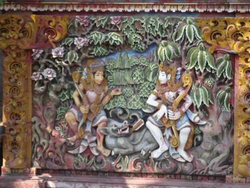  Relief cement design on a wall along the sidewalk 